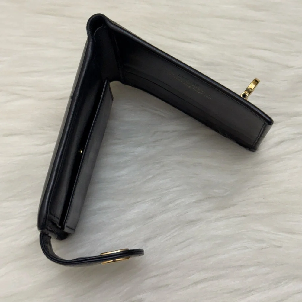 SALVATORE FERRAGAMO - BLACK LEATHER GOLD PLATED SECURE CLOSURE BIFOLD WALLET